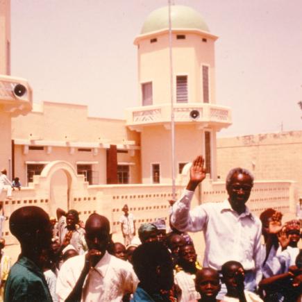 Crowd of people in front of a building